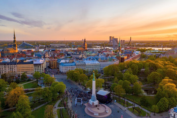 Beautiful sunset view over Riga by the statue of liberty - Milda in Latvia. The monument of...