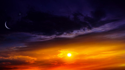 Crescent moon with beautiful sunset background . Generous Ramadan . Light from sky . Religion background .  