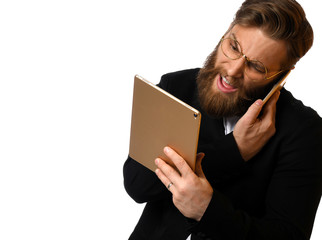 Smart business man in black suit and white shirt make a purchase online using tablet computer in glasses