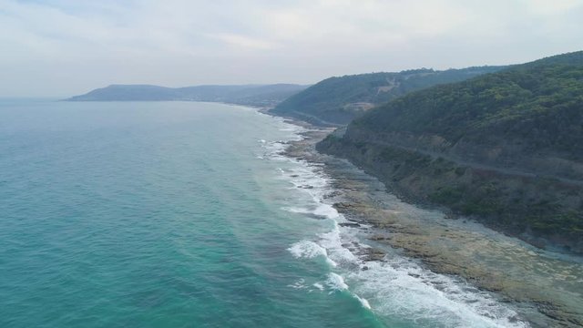 Drone flight along coastline next to the famous Great Ocean Road