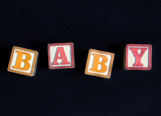 Centered red and orange blocks spelling "BABY"