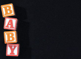 Red and orange blocks spelling "BABY"