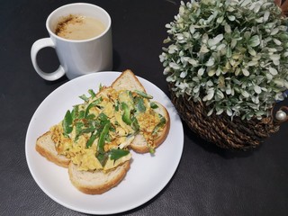 A very healthy and simple breakfast with coffee, bread and omelet. 
