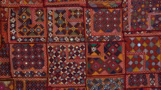 Detail old colorful patchwork carpet, establishing shot. Close up