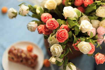Bread, milk, fruit and flowers on the table
