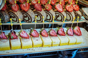 pastries in the cake shop, strawberry cakes on the shop window