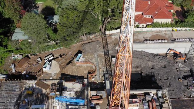 Horizontal working jib of a a tower crane working on an a residential building contruction site