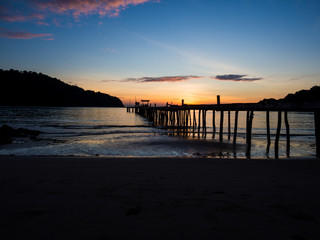 Wood bridge on the sea with a beautiful sunset at koh kood island, Thailand