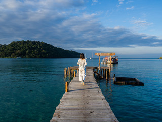 Traveler woman is relaxing on wood bridge in beautiful island, koh kood island, Trat Thailand, Nov 2018