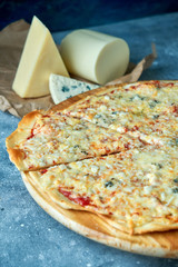 Slice of hot pizza large cheese lunch or dinner crust seafood meat topping sauce. with bell pepper vegetables delicious tasty fast food italian traditional on wooden board table classic in view