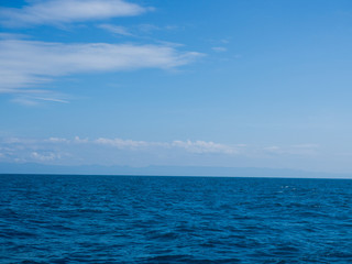 Naklejka na ściany i meble Landscape of sea horizon seascape under blue sky