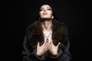 Beautiful Girl in Jewelry and Fur. Make-up and accessories