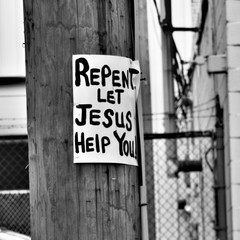 Religious message posted on a telephone pole