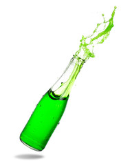 Green soda splashing out of glass bottle isolated on white background.