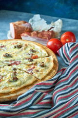 Slice of hot pizza large cheese lunch or dinner crust seafood meat topping sauce. with bell pepper vegetables delicious tasty fast food italian traditional on wooden board table classic in view