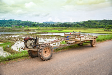 tractor in field rice planting in rainy season at asia