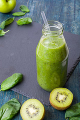 Fresh green smoothie with ingredients. Healthy food vegetables and fruits.