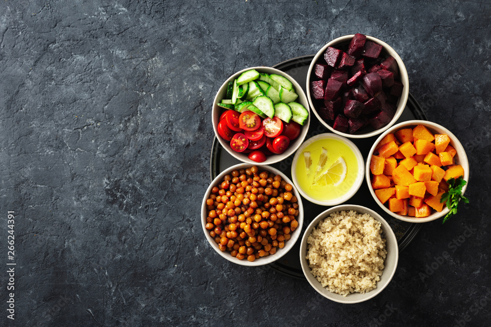 Poster Healthy vegetarian ingredients for cooking moroccan salad. Chickpeas, Baked pumpkin and beets, quinoa and vegetables top view copy space