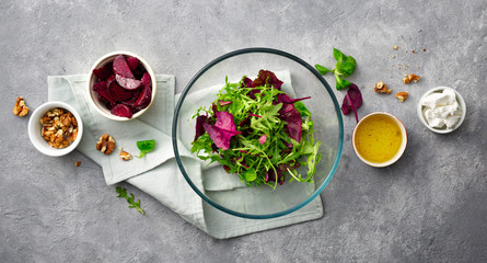 Cooking healthy food. Ingredients for preparation summer salad of baked beets on gray background