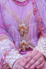 Beautiful and fashionable Malaysian Hijab Bride with beautiful handmade brooch.