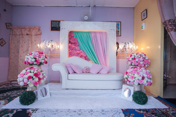 Bridal dais, wedding stage decoration built for the bride and groom on their wedding day. The couple will sit on the dais or pelamin