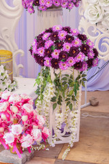 Close-up and selective focus of artificial flower use as wedding dais decoration. Wedding dais also known as 