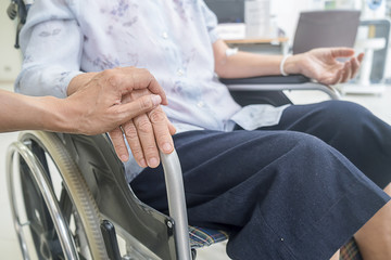 Senior woman on wheelchair in the hospital.