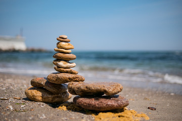cairn on sea background. pyramid