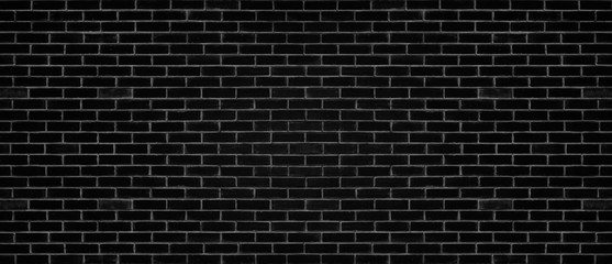 Black color brick wall for brickwork background design . Panorama format .