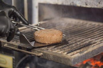 beef or pork cutlet on a josper grill for cooking burger