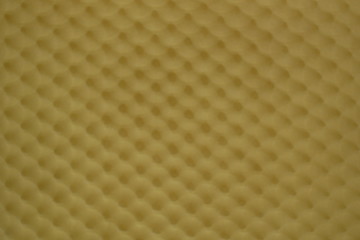 blurred yellow fabric background