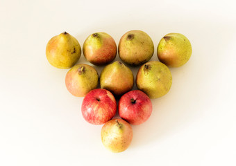 Naklejka na ściany i meble Fresh ripe pears and apples on white background, vegetarian concept.