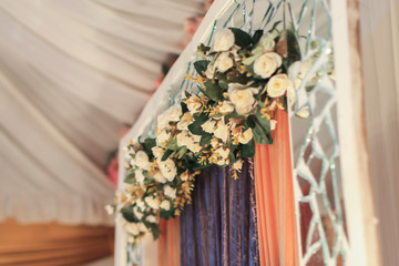 Close-up and selective focus of artificial flower use as wedding dais decoration. Wedding dais also known as 
