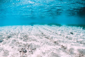Tropical blue sea with white sand underwater in Hawaii