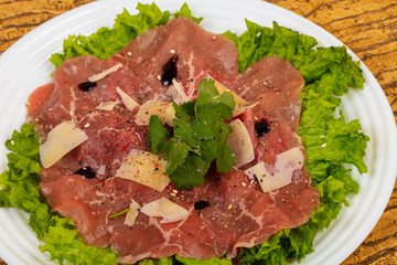 Beef carpaccio with parmesan cheese