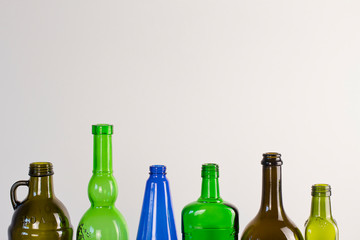  glass bottles on a white background. wine and beer bottles. colored glass. bottle background