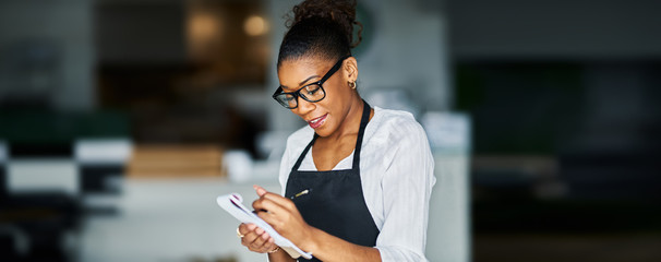 african american waitress taking order on notepad
