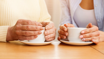 Coffee time. Mother and daughter drinking tea