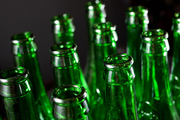 Green bottles of beer on a metal table