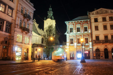 Fototapeta na wymiar Lviv panorama at night. View of the night street of the European medieval city. Lviv Market square at night. Concept - travel, landmarks, monument of architecture, world heritage. Long exposure