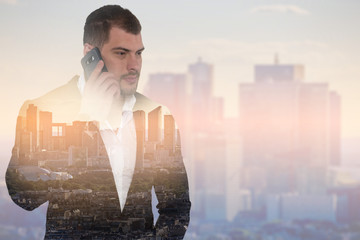 Double exposure image of businessman with smartphone on cityscape background
