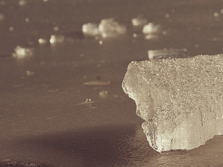 Cracks and bubbles in broken ice piece. Drifting ice floe © rdonar