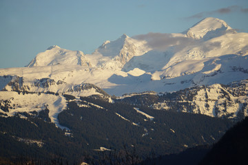 Fototapeta premium aerial view of Mont Blanc, France at dusk with wisps of clouds