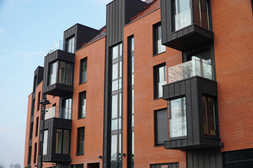 Fragment Facade of a multi-storey modern building. Сoncept of buying affordable housing