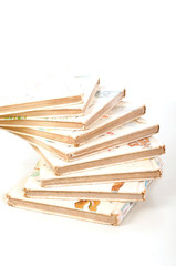 Stack of old books isolated on white