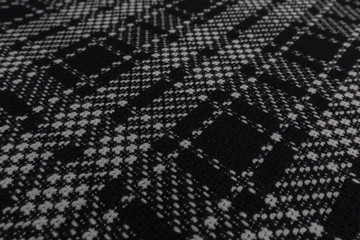 Beautiful closeup of black and white tartan fabric with textile texture background