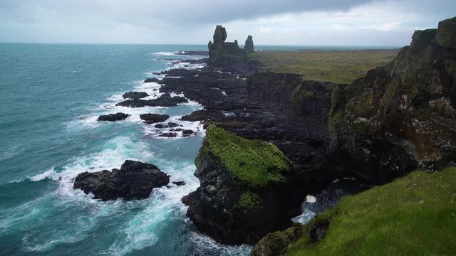 Londrangar in Snaefellsnes National Park, Iceland. Londrangar and hill Svalthufa are remains of a crater, which has been eroded to present form by sea. It is the tourist destination of west Iceland.