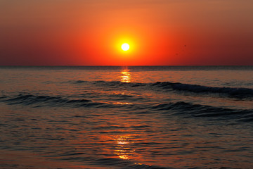 Beautiful sunrise over the quiet calm sea.