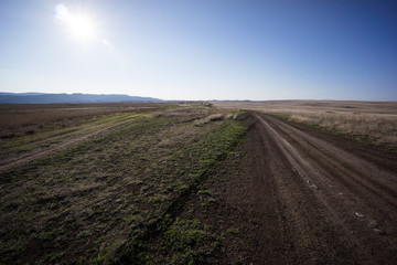 Fototapeta na wymiar georgia mud road at steppe landscape