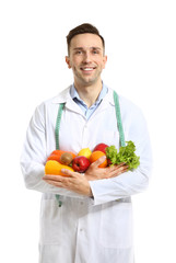Portrait of male nutritionist on white background